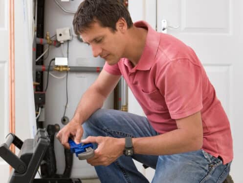 Handyman-performing-boiler-repair