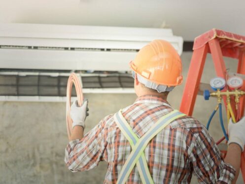 A-young-technician-installing-new-air-conditioning